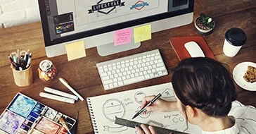 Female designer drawing logos